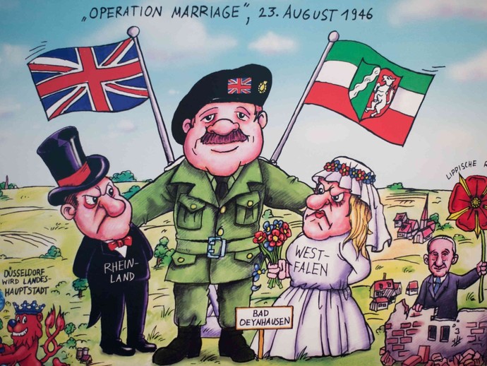 Karikatur: Britischen Staatsmann legt die Arme um die westfälische Braut und den rheinländer Bräutigam, um beide widerwillig miteinander zu vereinen.