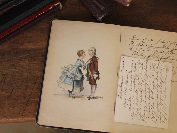 Bunte Zeichnung eines jungen Paares in einem Buch, das zwischen 1915 und 1918 geführt wurde. (öffnet vergrößerte Bildansicht)